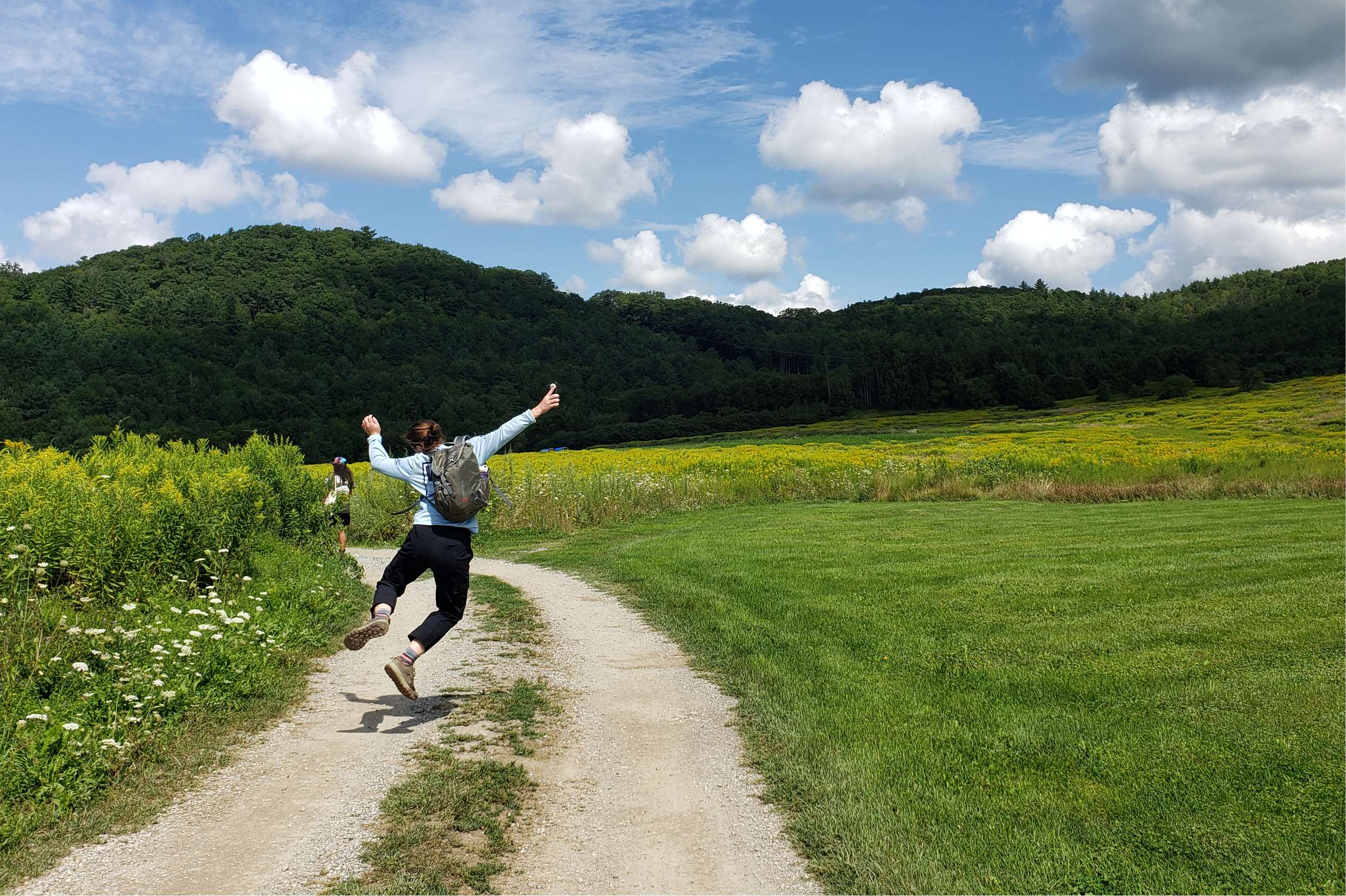 A VYCC Corps Member jumps for joy!